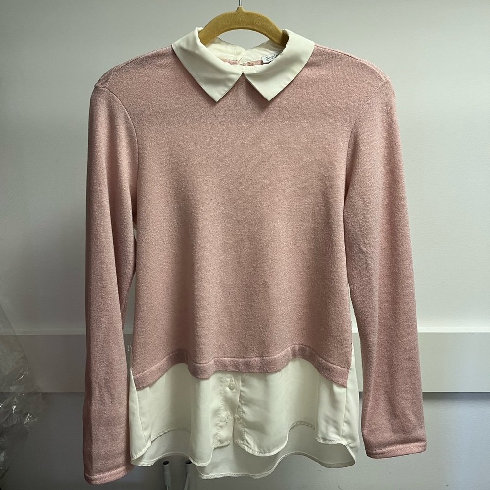 Women’s pink sweater with white blouse